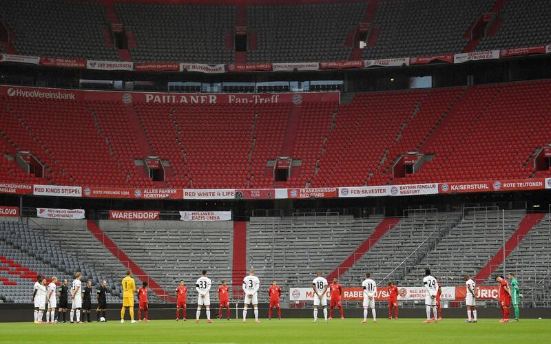 Players pay a minute of silence for the victims of the coronavirus prior. AP