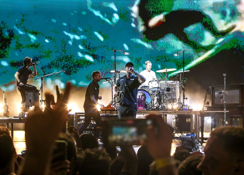 Frontman Ryan Tedder, centre right, works the crowd.