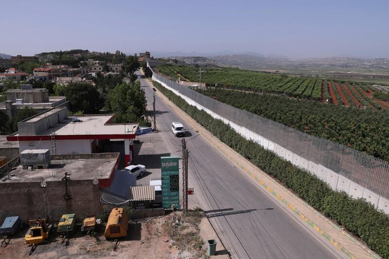 A car drives along the village of Kfar Kila on the Lebanese-Israeli border in southeast Lebanon. AP Photo