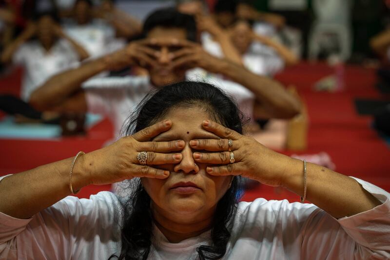 A woman takes part in International Day of Yoga celebrations in Guwahati, India. AP