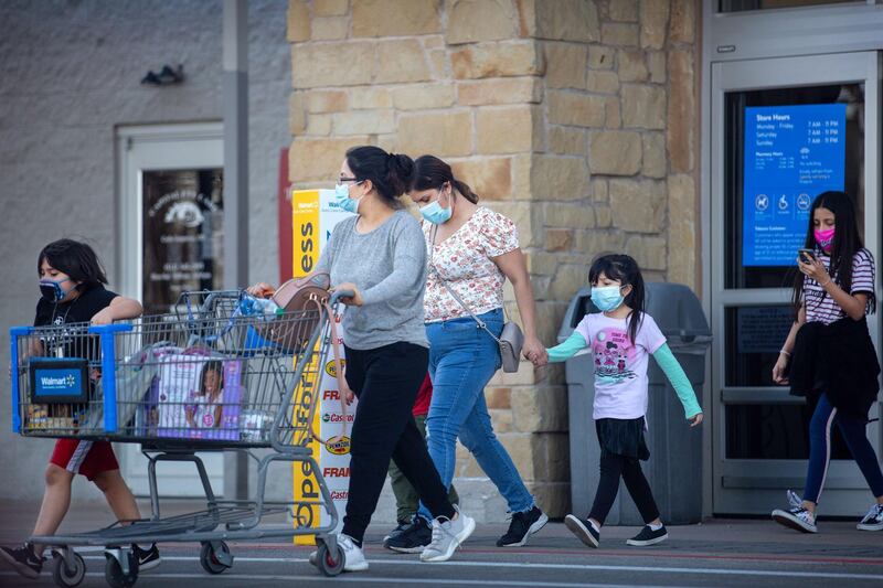 AUSTIN, TX - MARCH 03: Customers leave Walmart on March 3, 2021 in Austin, Texas. Gov. Greg Abbott announced today that the state will end its mask mandate and allow businesses to reopen at 100 percent capacity on March 10.   Montinique Monroe/Getty Images/AFP
== FOR NEWSPAPERS, INTERNET, TELCOS & TELEVISION USE ONLY ==
