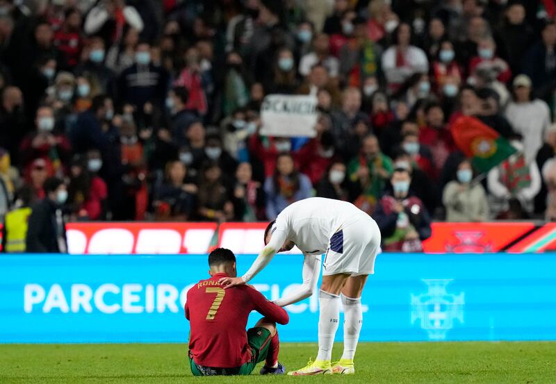 Portugal's Cristiano Ronaldo, left, speaks with Serbia's Filip Kostic at the end of the match. AP Photo