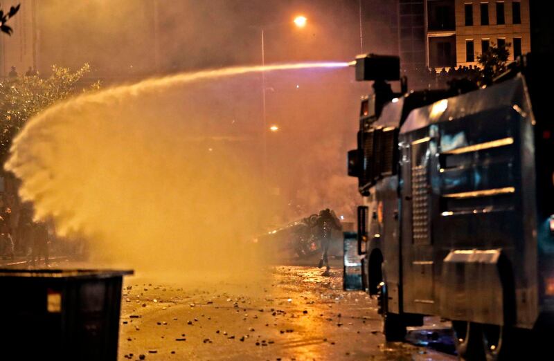 Lebanese security forces use a water canon to disperse supporters of Lebanon's Hezbollah and Amal groups. AFP