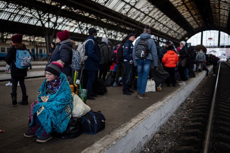 Passengers wait on the platform of Lviv railway station in Ukraine. AP
