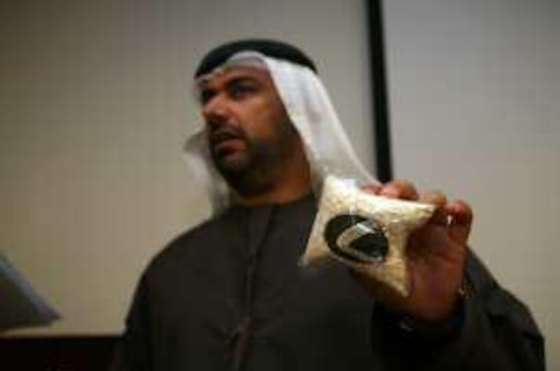 Dubai, UAE - December 14, 2009 - Yousef al Adiadi, Director of Administration Affairs, holds a a bag of captagon pills during a press conference to announce a major drugs bust of a shipment of 400,000 captagon pills at Dubai Police General Headquarters. (Nicole Hill / The National) *** Local Caption ***  NH Drugs04.jpg