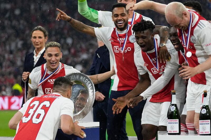 Antony, left, celebrates with Ajax teammates after clinching the Eredivisie title in May, 2022. AP