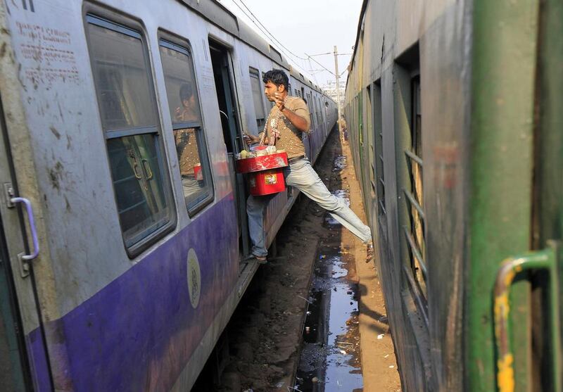 A vendor moves from one train to another at a railway station in Kolkata. Rupak De Chowdhuri / Reuters