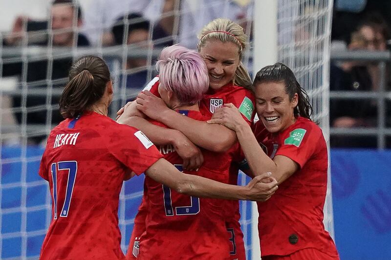 United States' midfielder Lindsey Horan, second right, celebrates with teammates after scoring. AFP