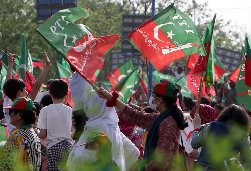 Supporters of Pakistan Tehreek-e-Insaf attend a rally. EPA
