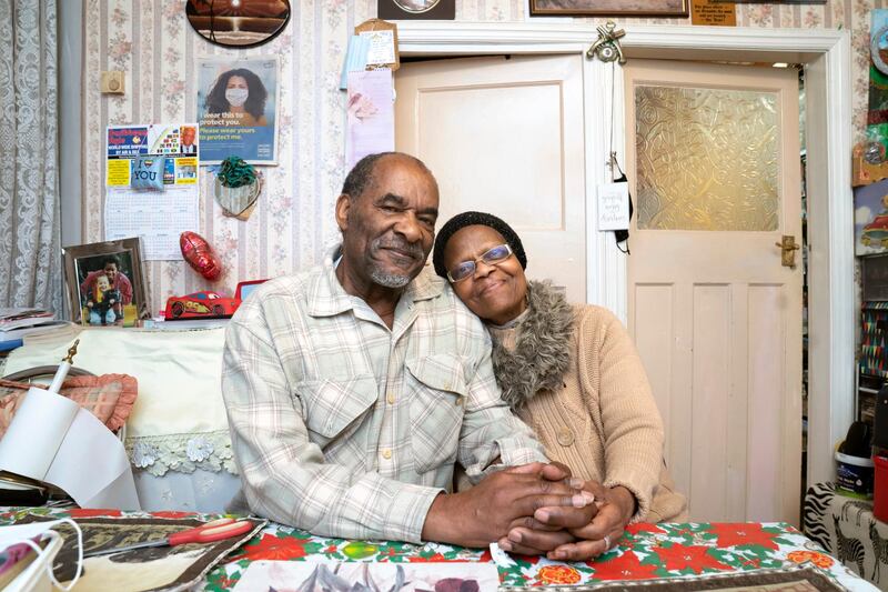 Sylius, left, and Bridgette Toussaint pose for a photo after having meals delivered by members of the Preston Windrush Covid Response team. AP Photo