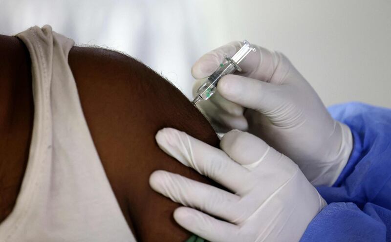 A Sinopharm coronavirus vaccine is given to a resident during a vaccination drive at the Guru Nanak Darbar gurudwara (Sikh temple), in Dubai. Karim Sahib / AFP