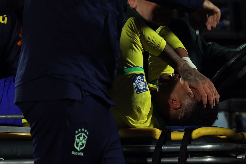 Neymar leaves the field after an injury. AFP