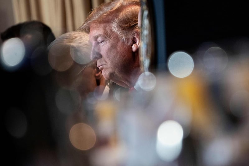 US President Donald Trump listens during the National Prayer Breakfast in Washington, DC. AFP