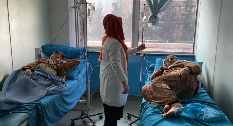 A staff member attends to hospital patients in Kabul. A lack of electricity is one of the factors contributing to a crisis for health care in Afghanistan, the World Health Organisation says. Anadolu Agency via Getty Images