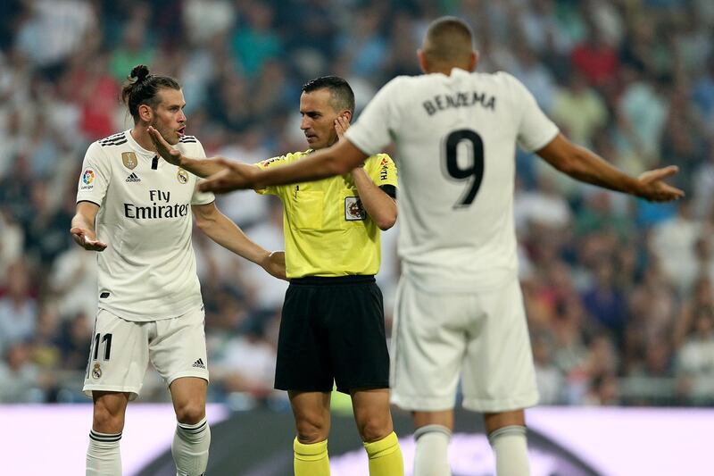 Karim Benzema, right, and Gareth Bale argue with the referee. AP Photo