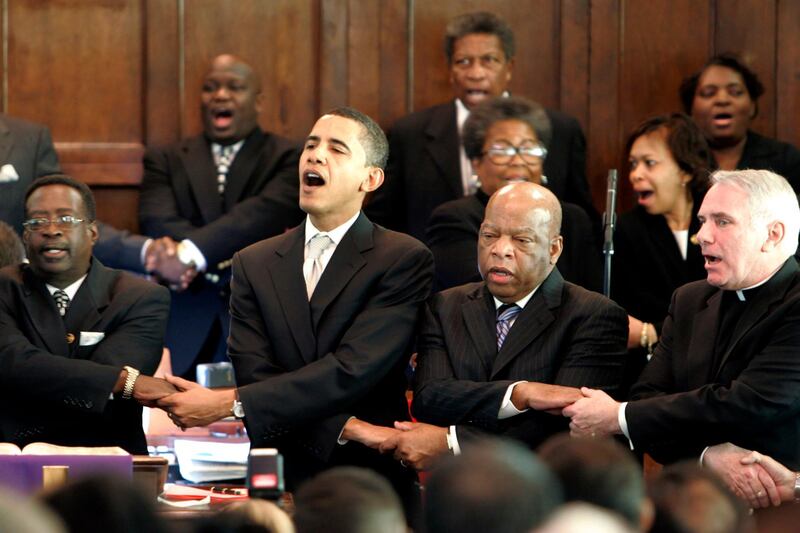 From left, Brown Chapel AME Church Pastor James Jackson, Democratic presidential candidate Senator Barack Obama, D-Ill., US Representative John Lewis, D-Georgia, and Rev. Clete Kiley, hold hands and sing at the end of a church service in Selma, Alabama, on the commemoration of the Rev. Martin Luther King Jr. protest march from Selma to Montgomery, on March 4, 2007. AP Photo