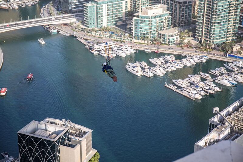 December 4, 2017.  Dubai Marina Mall.  The National reporter, Nick Webster,  gets on the XDubai Zipline, the World's Longest Urban Zipline.
Victor Besa for The National
National
Reporter:  Nick Webster