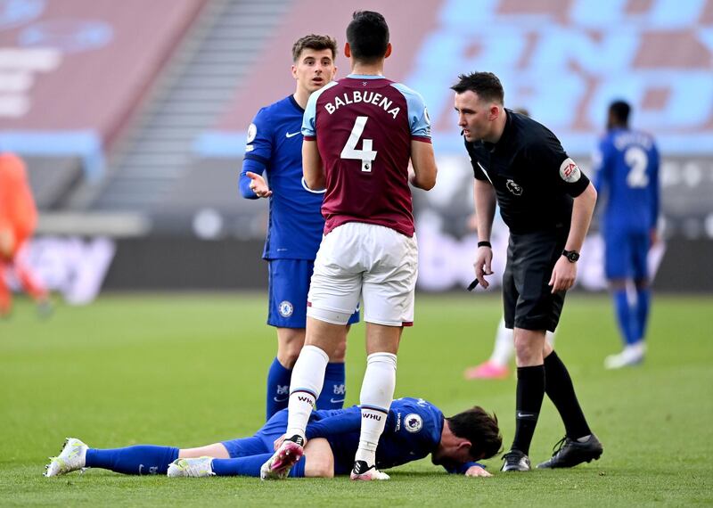 Referee Chris Kavanagh checks on Chelsea's Ben Chilwell after he is fouled by West Ham United's Fabian Balbuena. PA