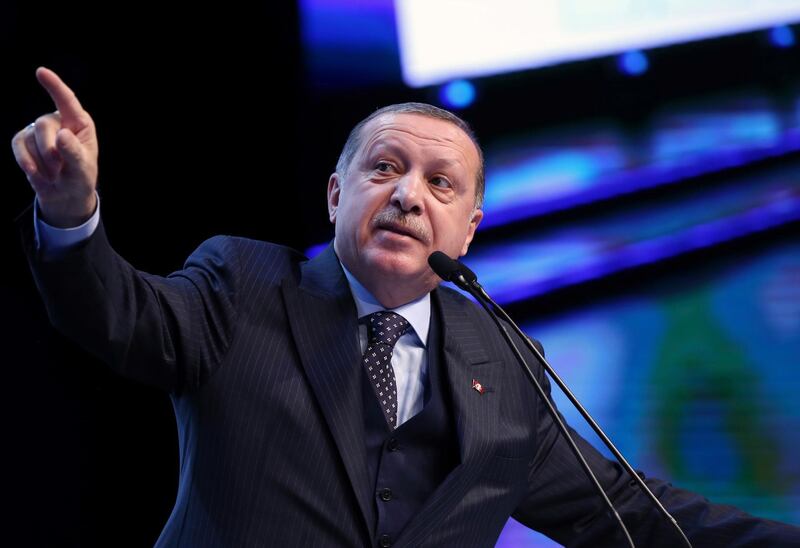 Turkey's President Recep Tayyip Erdogan, gestures as he talks at the closing ceremony of exporters' innovation and entrepreneurship week event, in Istanbul, Saturday, Dec. 9, 2017. Erdogan has called on Muslims to act within the scope of law and democracy and remain calm in their response to the U.S. President Donald Trump's recognition of Jerusalem as the capital of Israel.   (Yasin Bulbul/Pool via AP)
