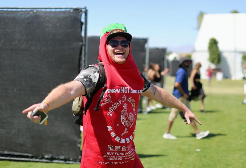 INDIO, CA - APRIL 14:  Festivalgoer dressed as a Sriracha bottle during day 1 of the Coachella Valley Music And Arts Festival (Weekend 1) at the Empire Polo Club on April 14, 2017 in Indio, California.  (Photo by David McNew/Getty Images for Coachella)