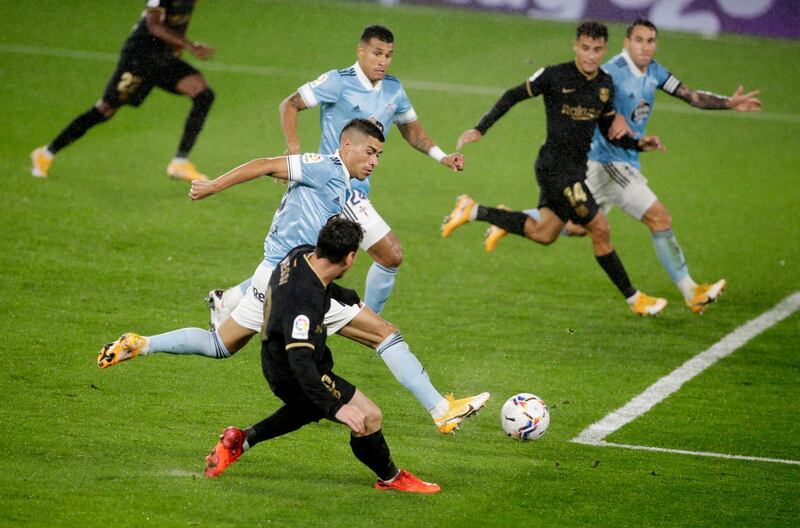 Celta Vigo’s Lucas Olaza scores an own goal and Barcelona’s second. Reuters