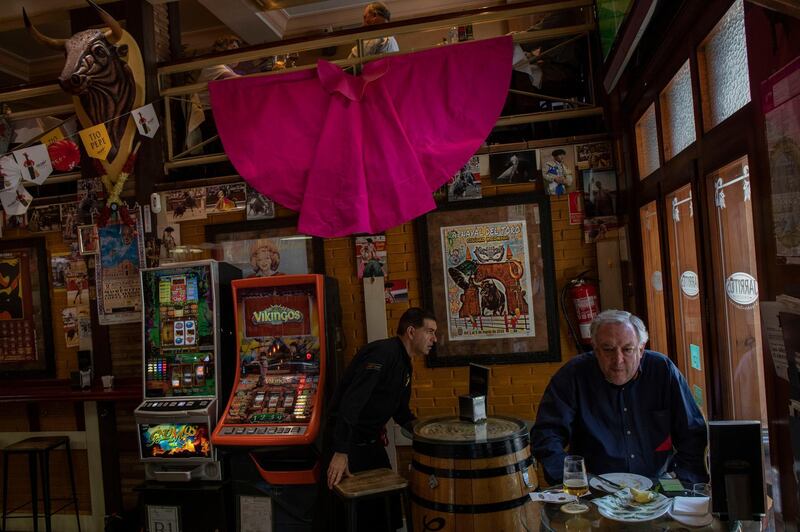 A customer has lunch in a restaurant in Madrid, Spain, Saturday, April 27, 2019. An uncertain outcome and the likelihood of the far-right entering Spain's Parliament looms over national elections on Sunday, when nearly 37 million Spaniards are called to cast ballots in the most highly polarized election in decades. (AP Photo/Bernat Armangue)