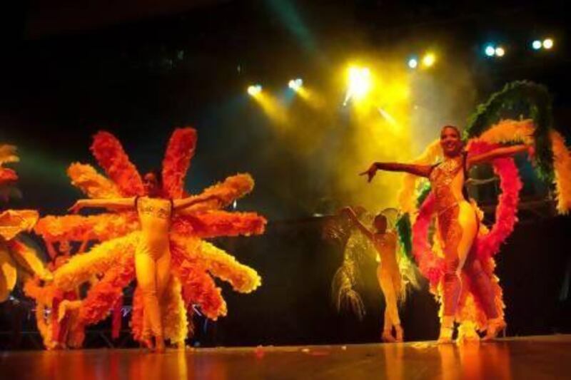 Performers from the Columbia- and Dubai-based BNF dance company light up the stage. Its new show celebrates global dance traditions with Latin elements. Courtesy BNF