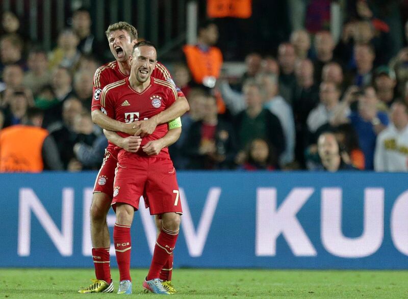 Bayern's Thomas Mueller, background, hugs team mate Bayern's Franck Ribery of France, at the end of the Champions League semifinal second leg soccer match between FC Barcelona and Bayern Munich at the Camp Nou stadium in Barcelona, Spain, Wednesday, May 1, 2013. (AP Photo/Matthias Schrader)  *** Local Caption ***  Spain Soccer Champions League.JPEG-0a1c4.jpg