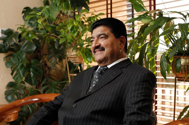 ABU DHABI, UNITED ARAB EMIRATES - December 31, 2009: Dr B. R. Shetty, Managing Director and CEO of NMC Group (NMC Specialty Hospital, UAE Exchange, Neopharma) sits for a portrait in his office. 
( Ryan Carter / The National ) *** Local Caption ***  RC005-DrShetty20091231.jpg