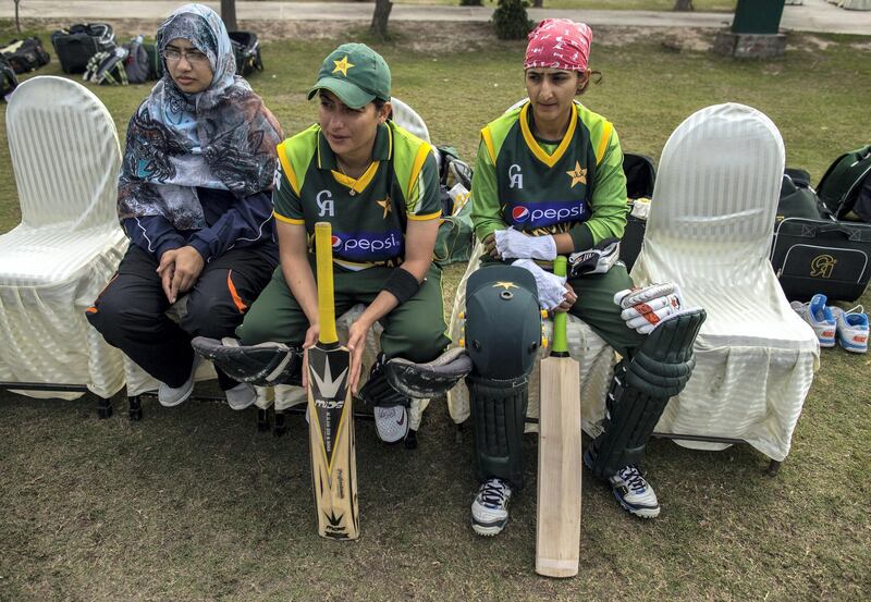 Sana Mir (C), captain of Pakistan's women's cricket team, sits with a physical therapist (L) and a team-mate during a training session in preparation for the 2014 International Cricket Council (ICC) World Twenty20 competition in Muridke February 22, 2014. Mir was enrolled in an engineering degree at a national university, but left to pursue her passion for cricket.Though instability continues to plague Pakistan and many areas are dominated by social conservatism, some of the country's more affluent residents have worked to fashion a very different kind of lifestyle for themselves. Pictures of men and women taking part in all sorts of activities and professions - from being a pilates instructor, to a textile retail entrepreneur, to a member of a rock band - offer a different view of Pakistan to images of conflict that often make the news. Picture taken February 22, 2014. REUTERS/Zohra Bensemra (PAKISTAN - Tags: SOCIETY SPORT CRICKET)

ATTENTION EDITORS - PICTURE 19 OF 25 FOR PACKAGE 'THE OTHER PAKISTAN'
TO FIND ALL IMAGES SEARCH 'ZOHRA UPPER'