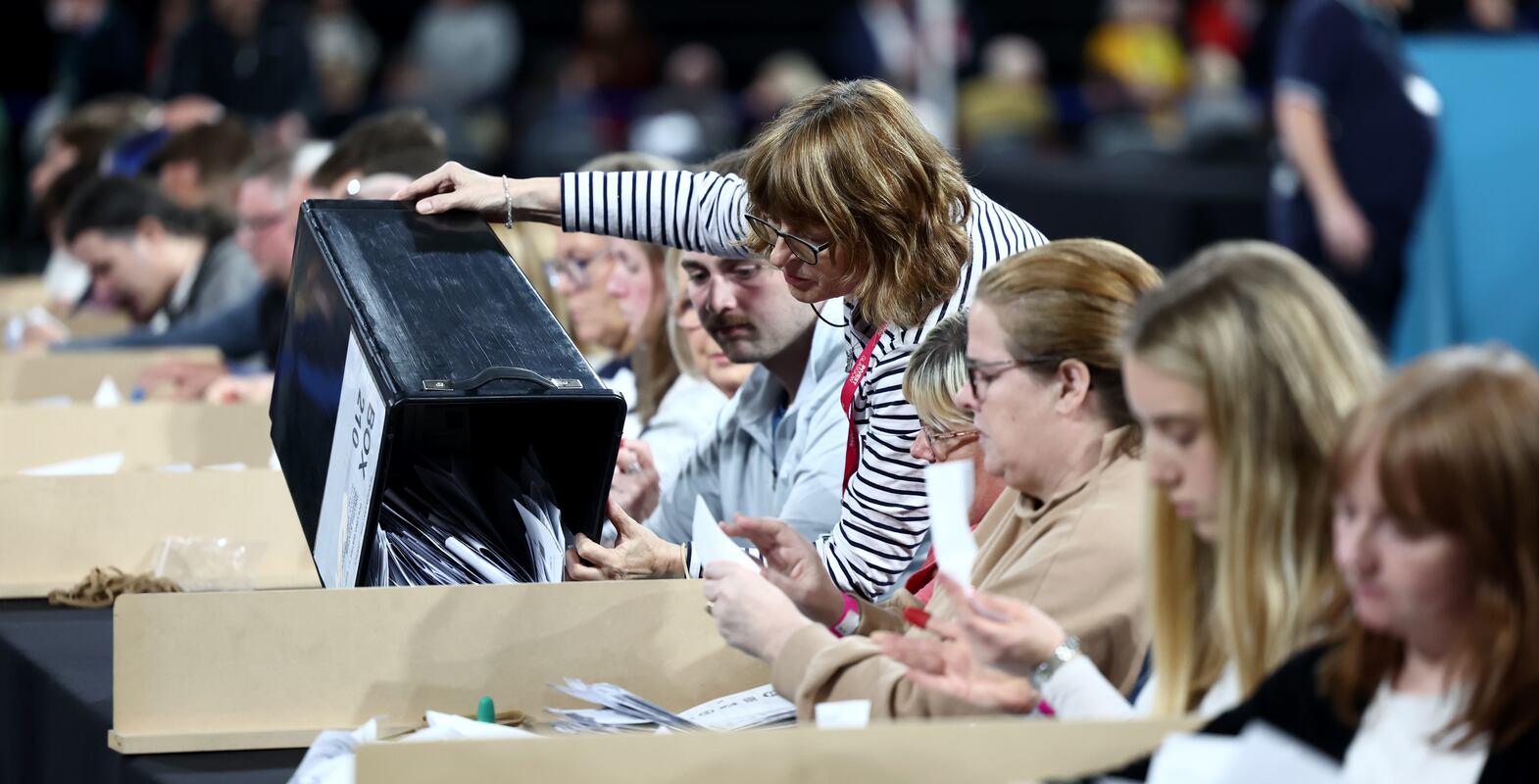 Ballot papers are tipped out onto a table by counting staff at the counting centre at Emirates Arena as the UK general election count begins on July 4, 2024 in Glasgow, Scotland. Getty Images