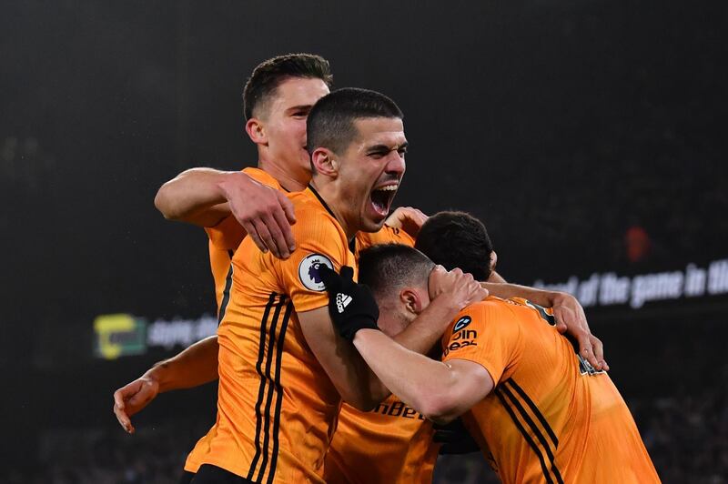 Wolves defender Matt Doherty  celebrates with teammates after he scores his team's third goal. AFP