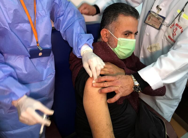 A man receives an injection with Sputnik V vaccine against Covid-19. Reuters
