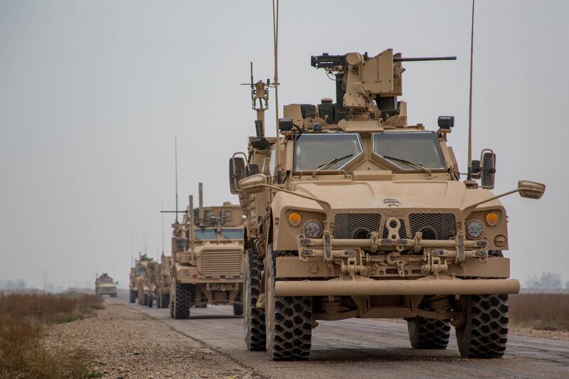 A Coalition convoy of U.S. led international coalition against the Islamic State of Iraq and the Levant (ISIL) stops to test fire their M2 machine guns and MK19 grenade launcher in the Middle Euphrates River Valley in the Deir ez-Zor province, Syria, November 22, 2018. Picture taken November 22, 2018. Courtesy Matthew Crane/U.S. Army/Handout via REUTERS ATTENTION EDITORS - THIS IMAGE HAS BEEN SUPPLIED BY A THIRD PARTY.