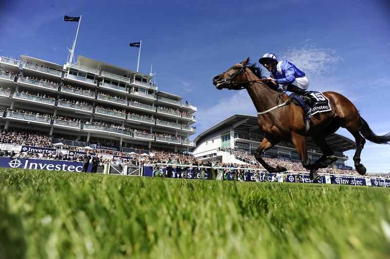 Paul Hanagan riding Taghrooda to victory in the English Oaks at Epsom Racecourse on June 6, 2014, in Epsom, England. Alan Crowhurst / Getty Images