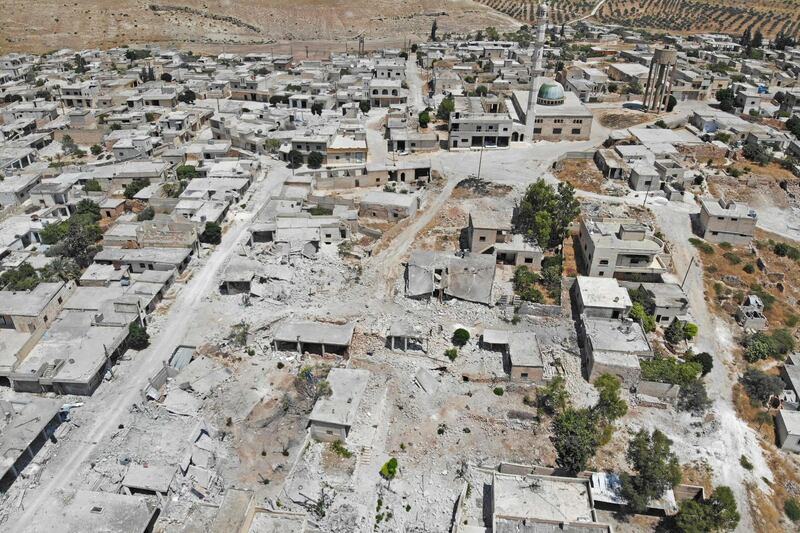 An aerial view of damaged and destroyed buildings in the town of Maaret Hurmah in the southern countryside of Syria's northwestern Idlib province. AFP