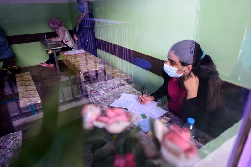 Iraqi high school students during their final exam after five months of school closures due to the coronavirus pandemic, at a school in Baghdad, Iraq.  EPA