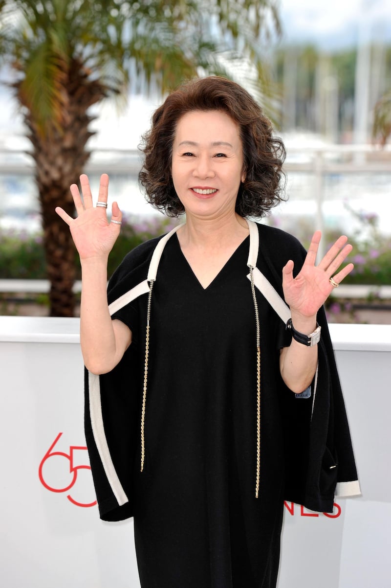 CANNES, FRANCE - MAY 21:  Actress Youn Yuh-jung poses at the "Da-reun Na-ra-e-suh" photocall during the 65th Annual Cannes Film Festival at Palais des Festivals on May 21, 2012 in Cannes, France.  (Photo by Gareth Cattermole/Getty Images)