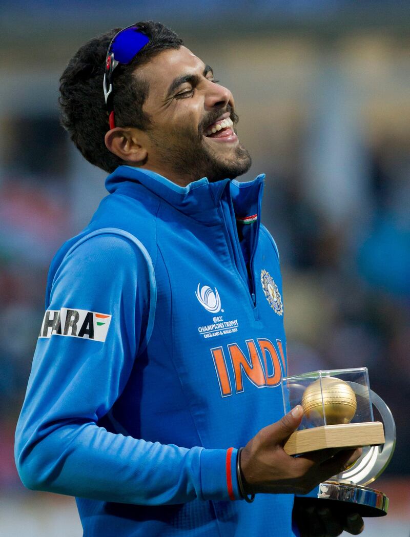 India's Ravindra Jadeja laughs after winning the golden ball and man of the match award after his side's win by 5 runs over England in the ICC Champions Trophy Final cricket match at Edgbaston cricket ground, Birmingham, England, Sunday June 23, 2013. (AP Photo/Jon Super) *** Local Caption ***  Britain ICC Trophy England India Cricket.JPEG-0f2e1.jpg