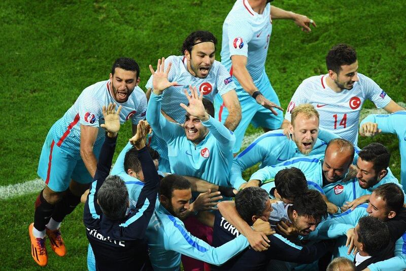 The Turkey team and players celebrate their second goal during the UEFA EURO 2016 Group D match between Czech Republic and Turkey at Stade Bollaert-Delelis on June 21, 2016 in Lens, France. (Photo by Matthias Hangst/Getty Images)