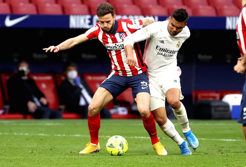 Atletico Madrid's Saul Niguez in action against Real Madrid's Casemiro. EPA