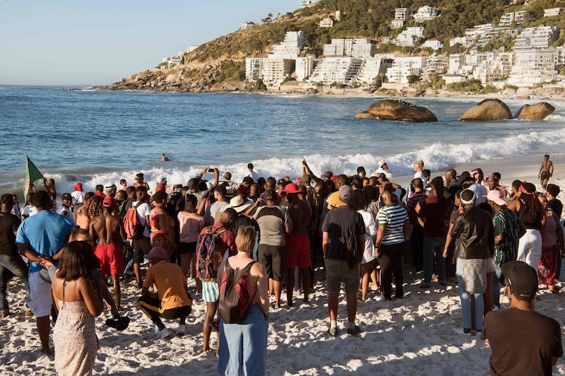 Protestors from different political groups take part in a demonstration on Clifton beach on December 28, 2018, in Cape Town, during which they slaughtered a sheep in a supposed ritual to tackle racism after beachgoers were told to leave the beach on December 23 by guards of a private security firm PPA.
 A fresh race row has erupted in South Africa after a private security company allegedly ordered black beachgoers to vacate a fashionable Cape Town over the Christmas holiday. Beaches, like many public areas, were segregated under white-minority apartheid rule, and have since been a flashpoint of racial tension in South Africa. / AFP / RODGER BOSCH
