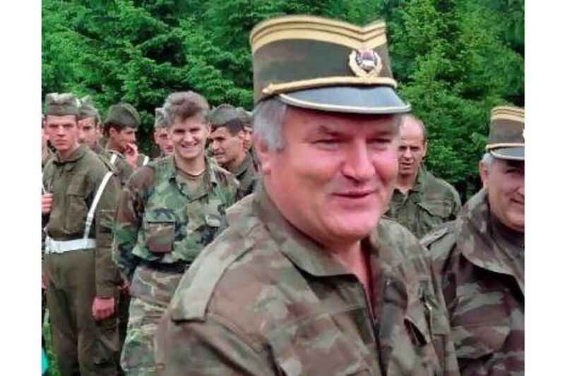 A reader says the trial of Ratko Mladic, pictured with his troops in 1996, is being drawn out for too long. AP Photo / STR