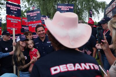 Florida Governor Ron DeSantis greets supporters before the Old Town Day Parade in Londonderry, New Hampshire. Reuters