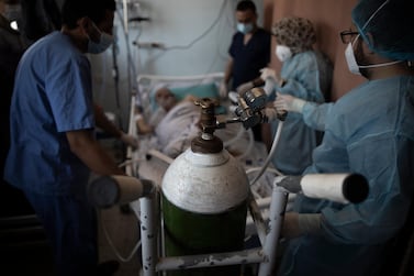 A Palestinian Covid-19 patient receives oxygen inside the intensive care unit of the Gaza European Hospital in the Gaza Strip. AP Photo