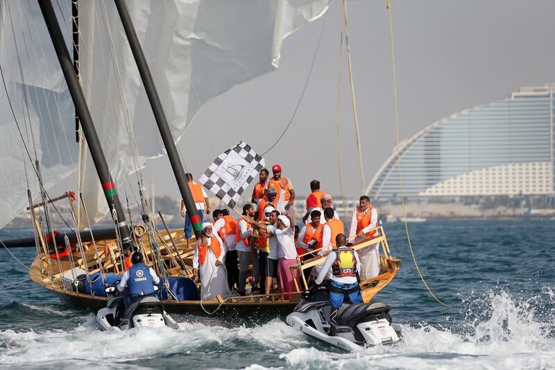 Emirati team celebrate their winning of the 29th annual dhow sailing race, known as The Gaffal, at the finish line in Dubai. AFP