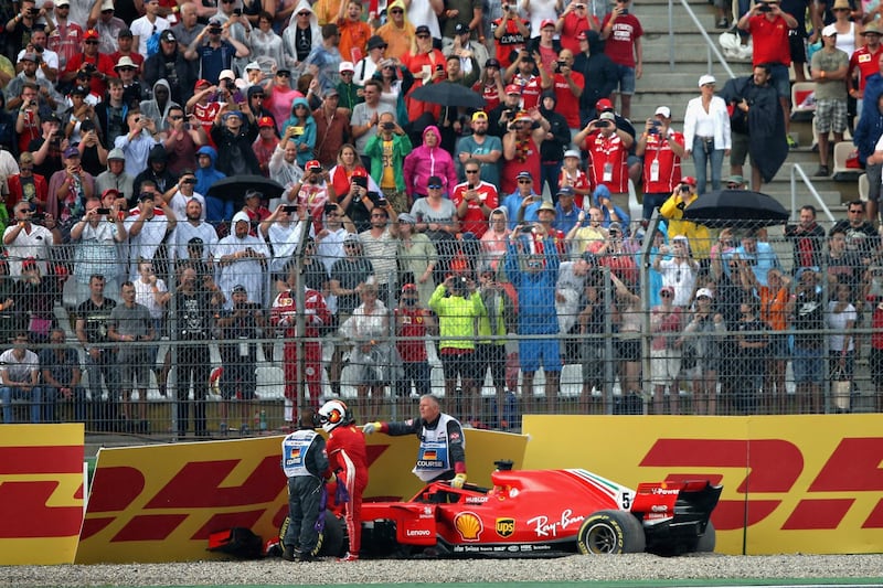 HOCKENHEIM, GERMANY - JULY 22:  Sebastian Vettel of Germany driving the (5) Scuderia Ferrari SF71H walks from his car after crashing during the Formula One Grand Prix of Germany at Hockenheimring on July 22, 2018 in Hockenheim, Germany.  (Photo by Charles Coates/Getty Images)