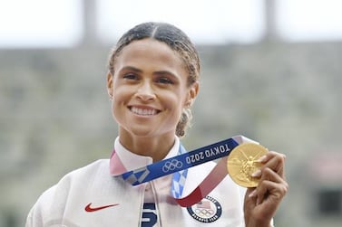 Sydney McLaughlin of the United States poses with her gold medal in the women's 400-meter hurdles at the Tokyo Olympics on Aug. 4, 2021, at the National Stadium in Tokyo. (Photo by Kyodo News via Getty Images)