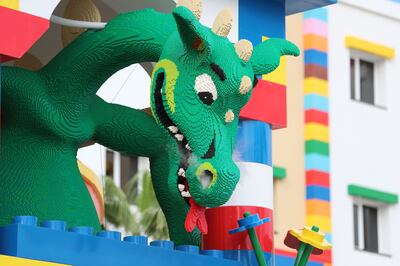 A smoke-breathing Lego dragon welcomes guests into Legoland Hotel at Dubai Parks and Resorts. Chris Whiteoak / The National