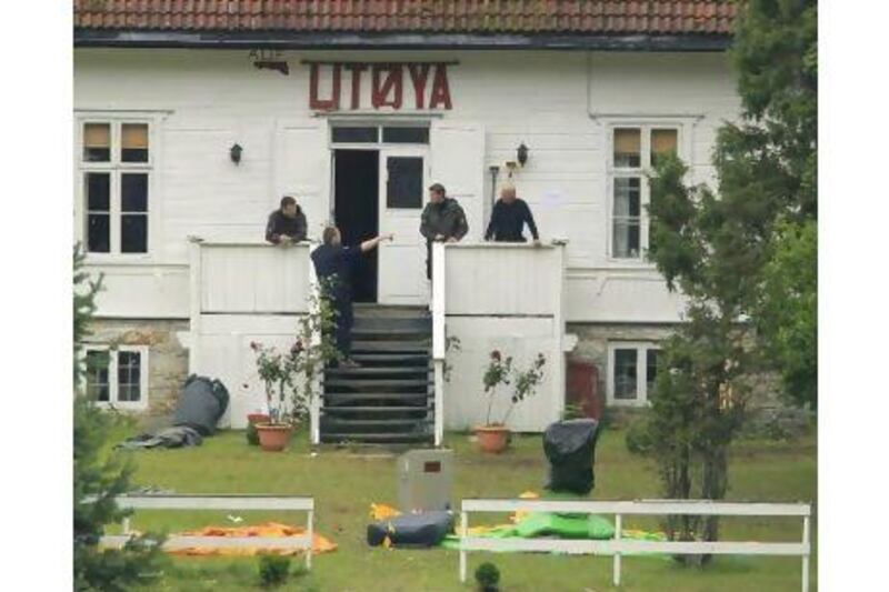 Police continue their investigations on the island of Utoya where the massacre took place. Terje Bendiksby / EPA